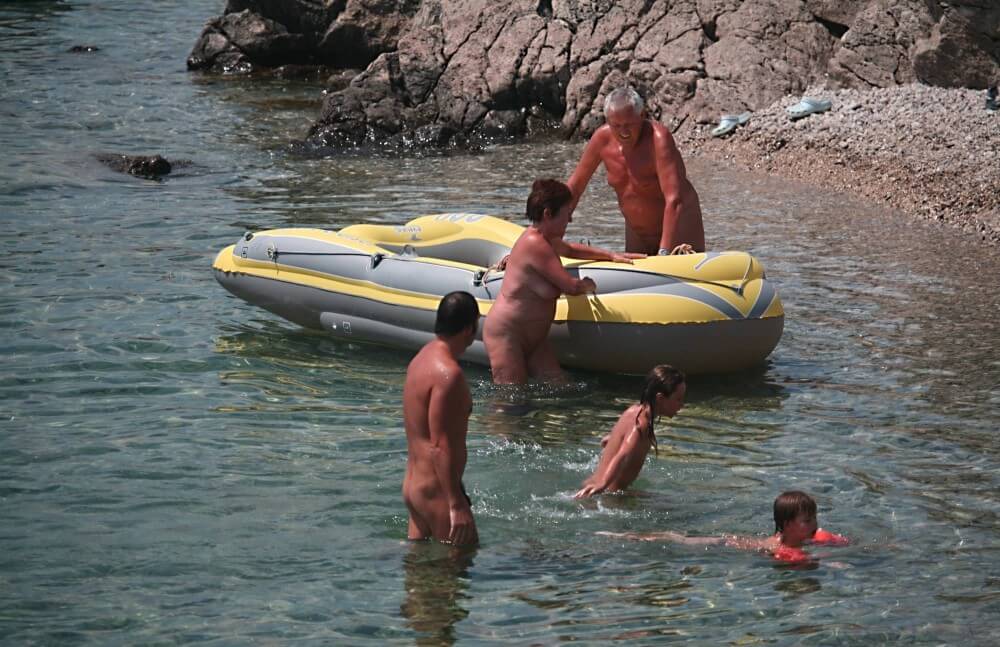[OnnDL] Lone Nudist in Yellow Boat photos